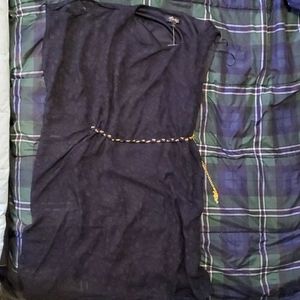 Black dress with one strap shoulder and one slit.